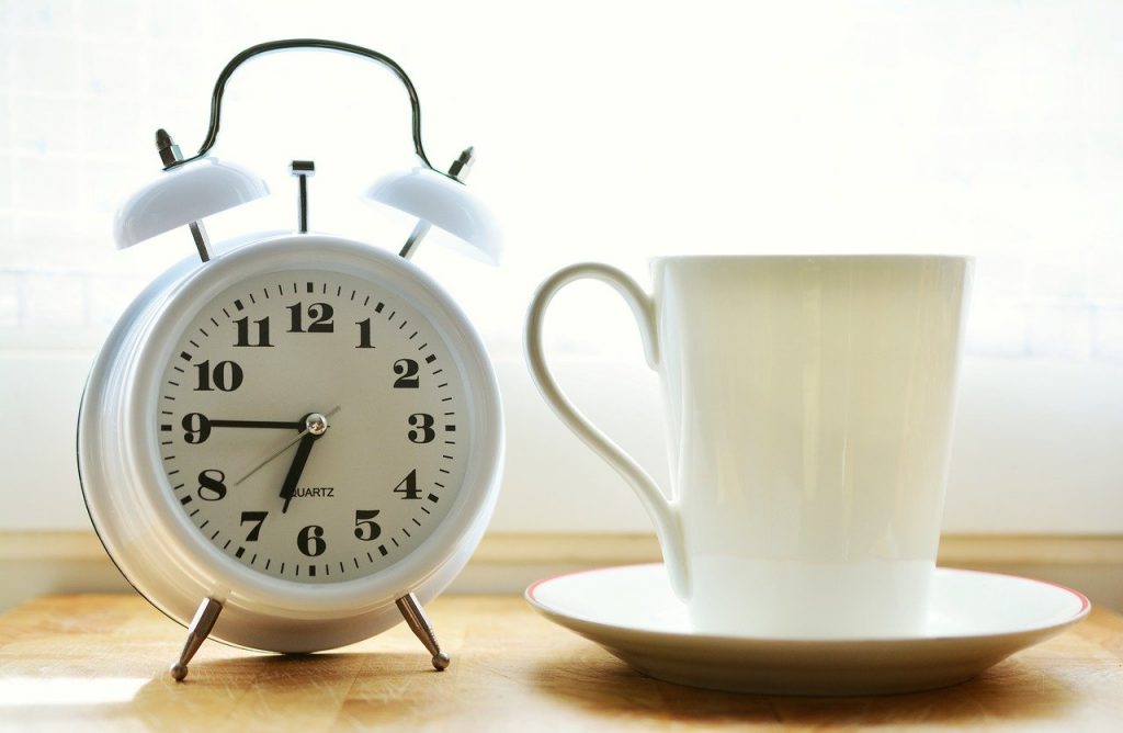 a clock and a coffee mug